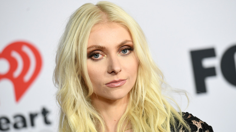 Taylor Momsen smiles slightly