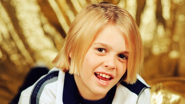 A young Aaron Carter smiles
