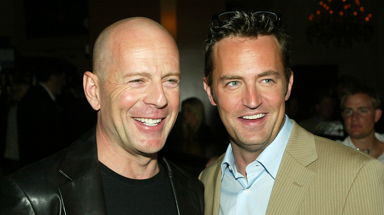 Matthew Perry and Bruce Willis smiling