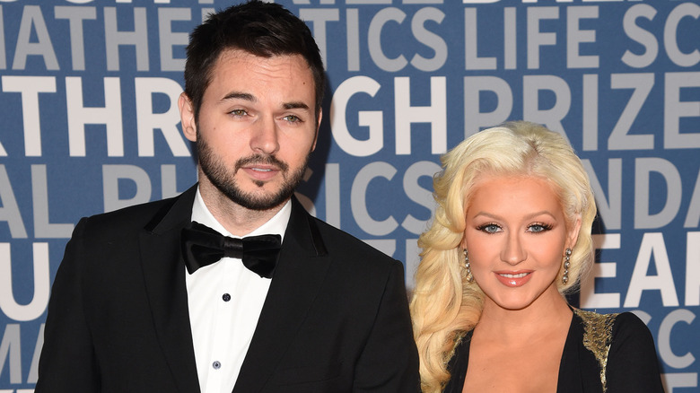 Matthew Rutler posing with Christina Aguilera