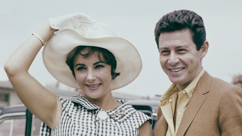 Elizabeth Taylor white hat Eddie Fisher smiling