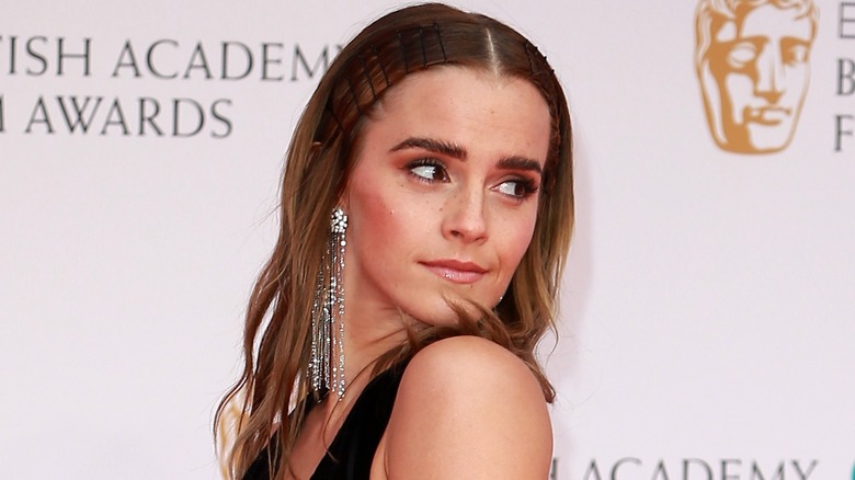Emma Watson glancing over shoulder
