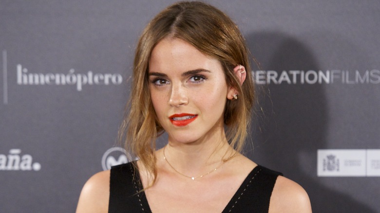 Emma Watson posing in orange lipstick