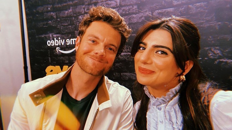 Jack Quaid and Claudia Doumit pose