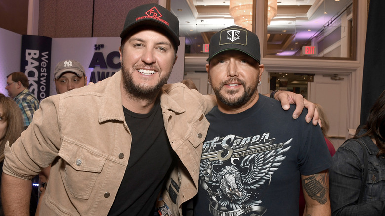 Luke Bryan and Jason Aldean, both smiling