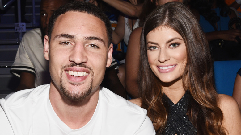 Klay Thompson and Hannah Stocking smile together
