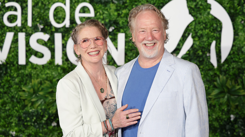 Melissa Gilbert and Timothy Busfield smile at an event