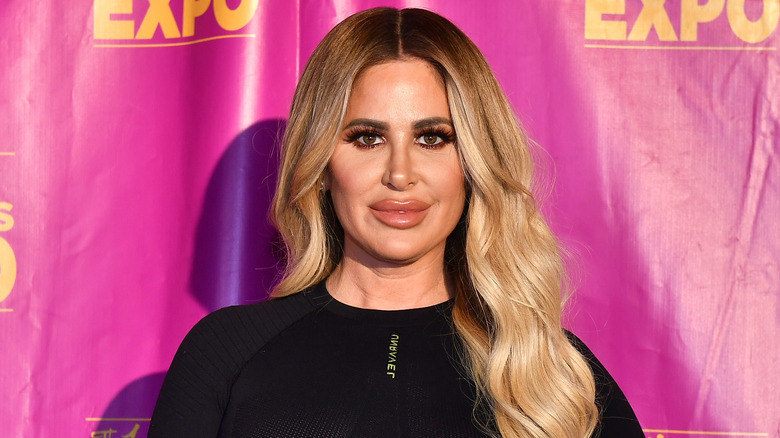 Kim Zolciak posing at event