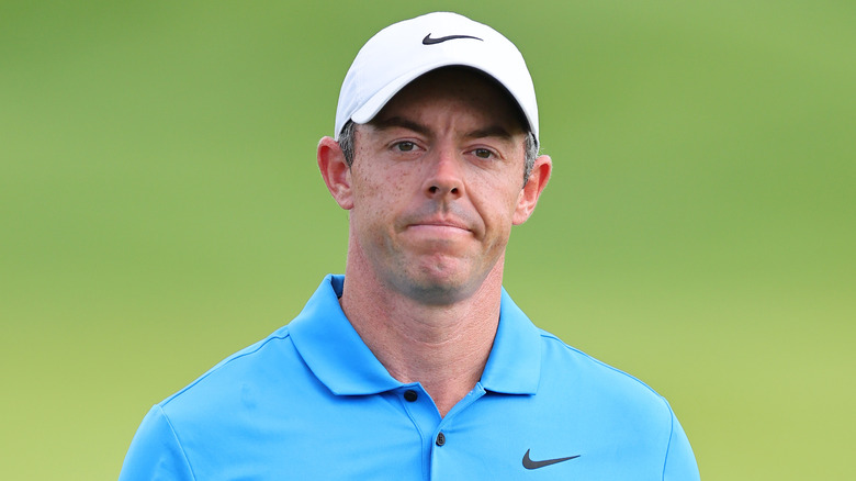 Rory McIlroy wearing a white cap