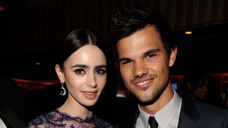 Taylor Lautner and Lily Collins smiling