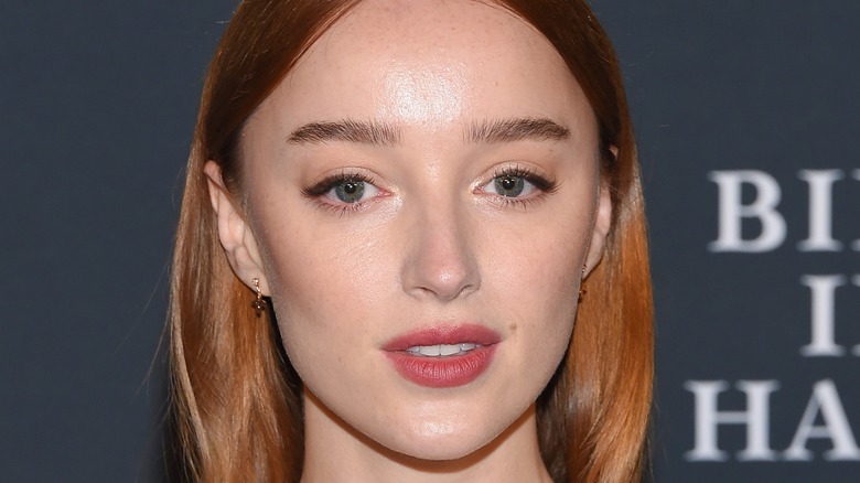 Phoebe Dynevor posing at event