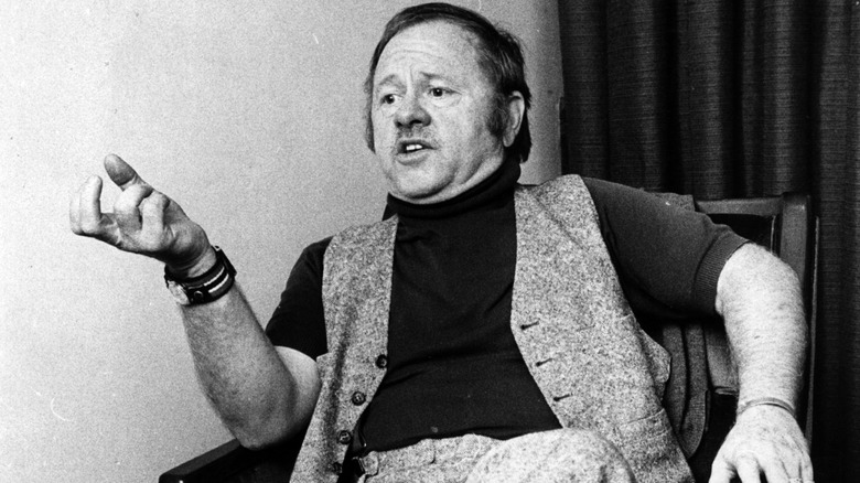 Mickey Rooney pictured having a conversation.