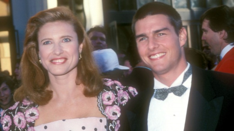 Mimi Rogers and Tom Cruise smiling 