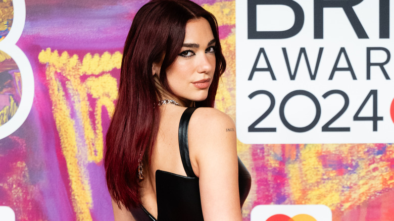 Dua Lipa, smirking