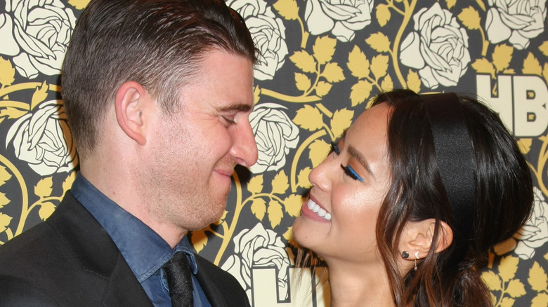 Bryan Greenberg and Jamie Chung smiling at each other