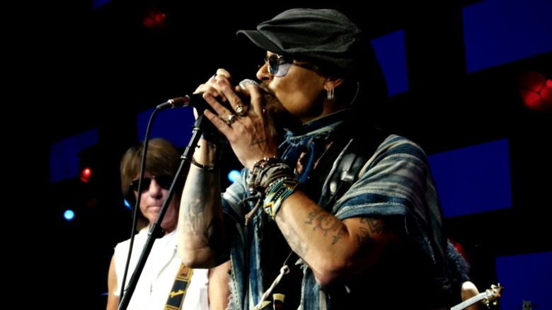Johnny Depp and Jeff Beck performing onstage