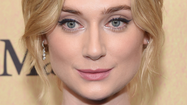 Elizabeth Debicki with a small smile