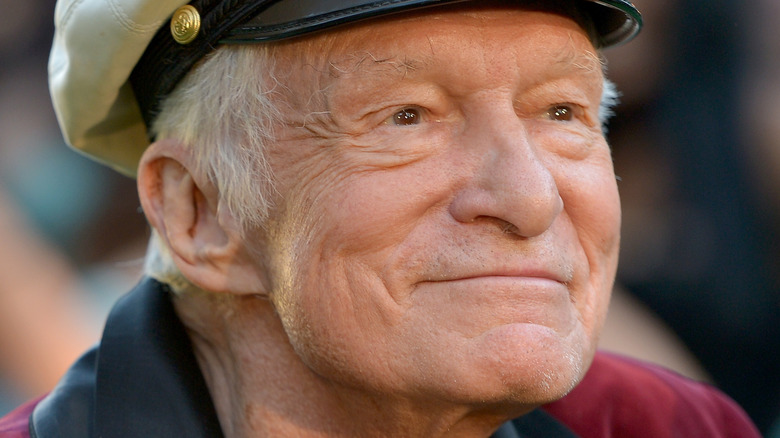 Hugh Hefner smiling in hat