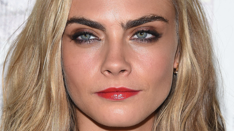 Cara Delevingne with a neutral expression