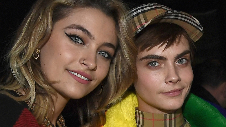 Paris Jackson and Cara Delevingne smiling