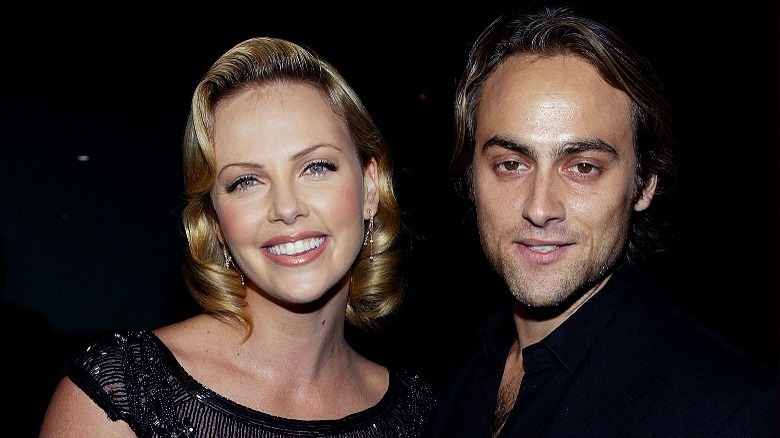 Charlize Theron and Stuart Townsend, smiling