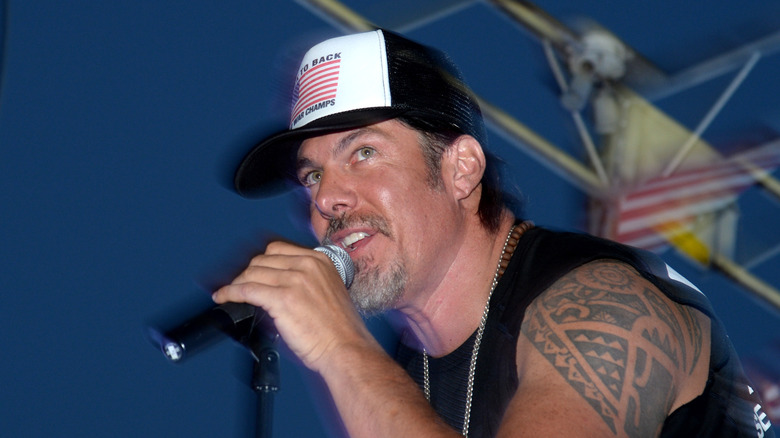 Tim Medvetz holding a microphone