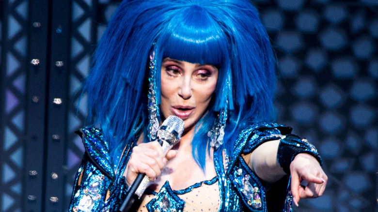 Cher singing and pointing