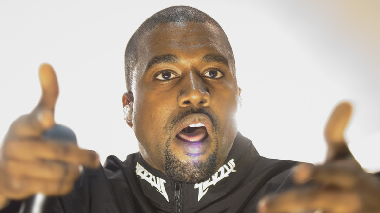 Kanye West performing live in Yeezy jacket