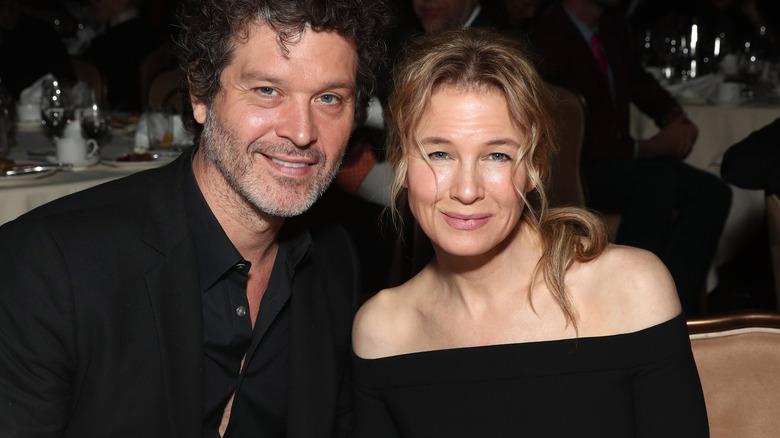 Doyle Bramhall II and Renee Zellweger posing