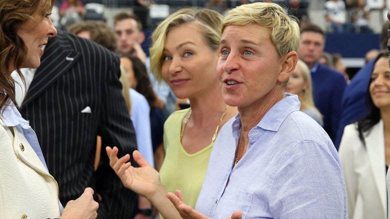 Ellen and Portia walking through a crowded event