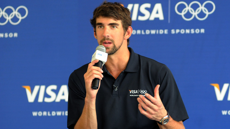 Michael Phelps at a microphone