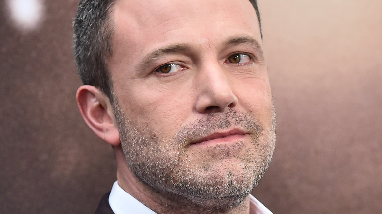 Ben Affleck smirks on the red carpet