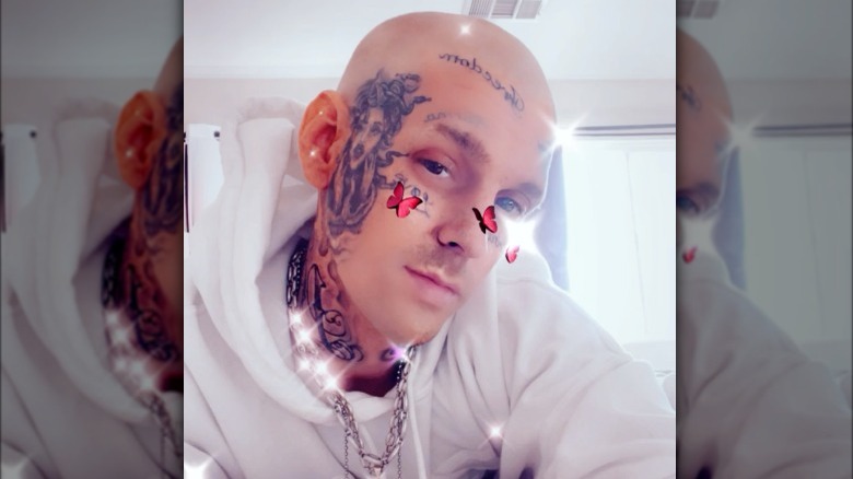 Aaron Carter with shaved head and tattoos