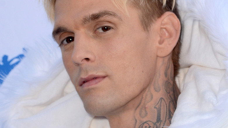 Aaron Carter posing in white