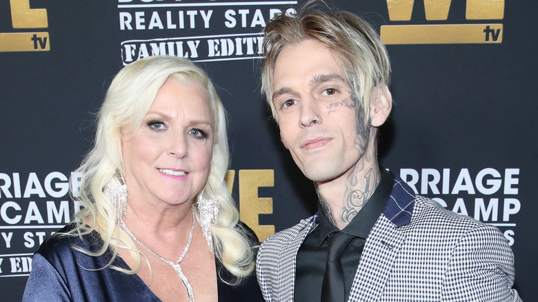 Jane Carter posing with her son Aaron Carter