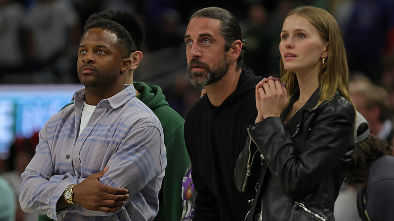 Randall Cobb, Aaron Rodgers, Mallory Edens watching game
