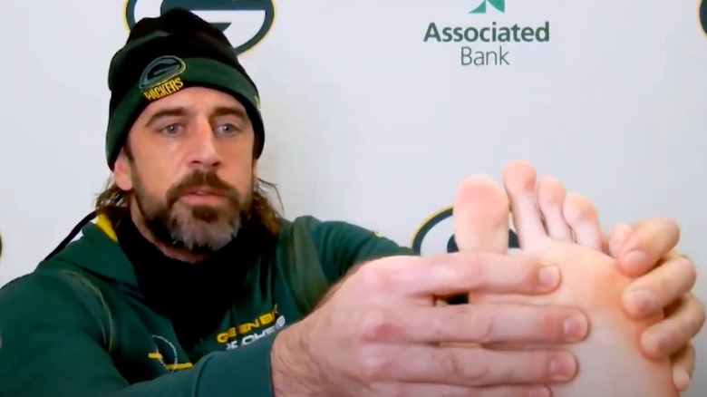 Aaron Rodgers showing foot during Zoom news conference