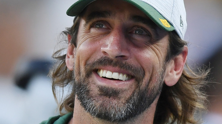 Aaron Rodgers smiling on the field