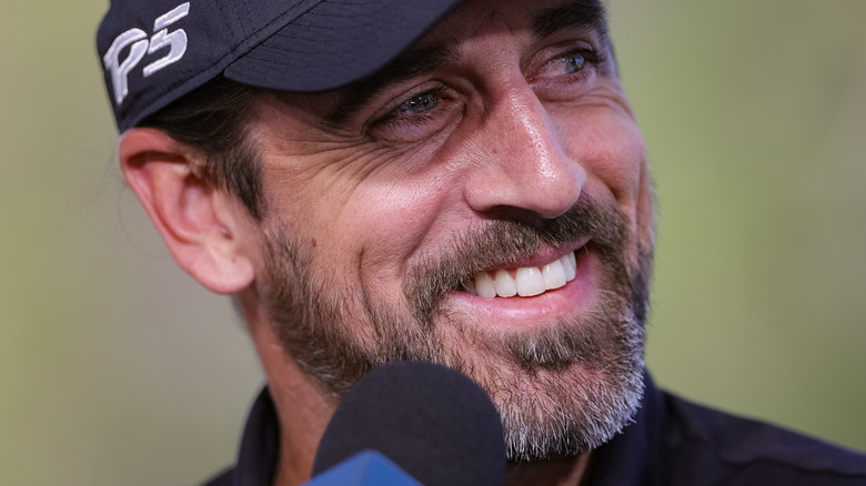 Aaron Rodgers smiling during an interview