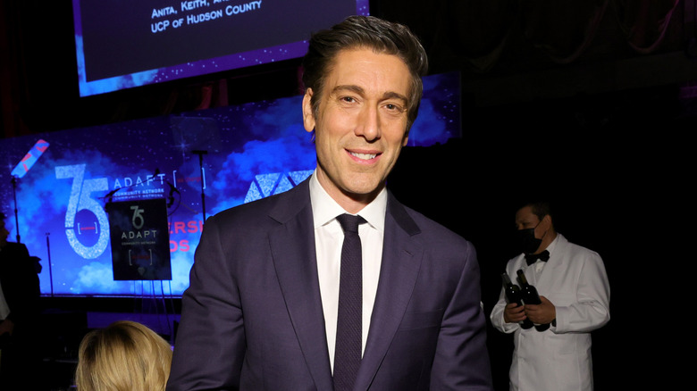 David Muir posing at event