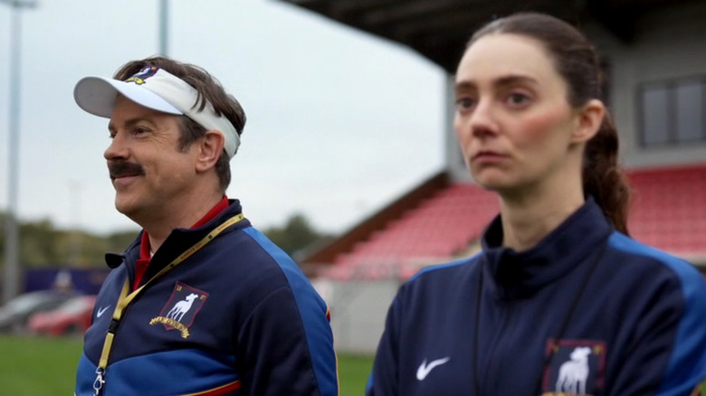 Ted (Jason Sudeikis) and Alice (Tanya Reynolds) coaching in Ted Lasso episode Riches of Embarrassment