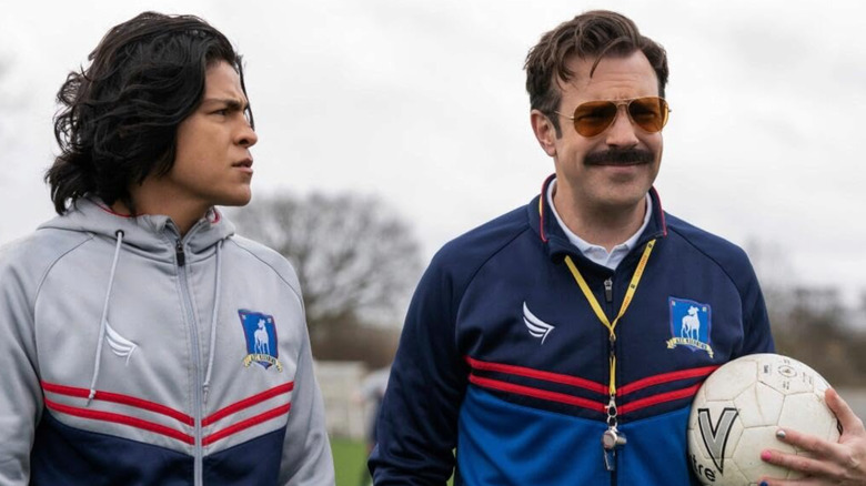 Dani (Cristo Fernandez) and Ted Lasso (Jason Sudeikis) on the soccer field in the episode Goodbye Earl