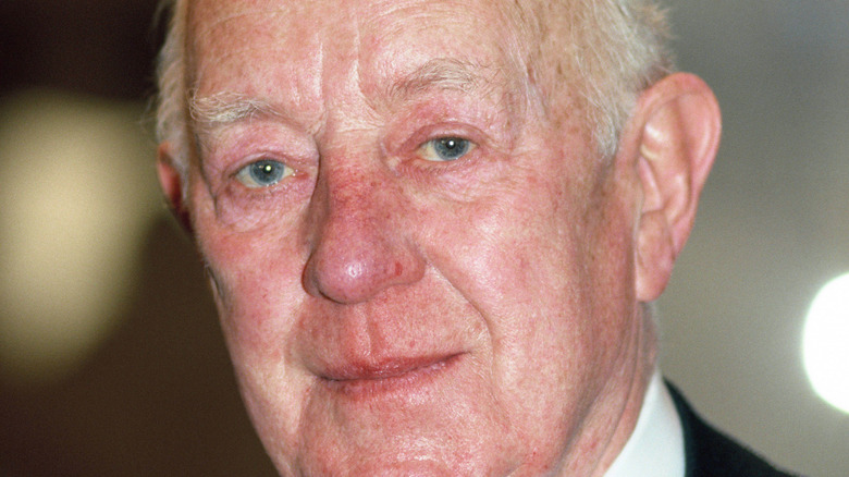 Alec Guinness black suit