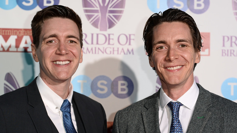 James and Oliver Phelps smiling