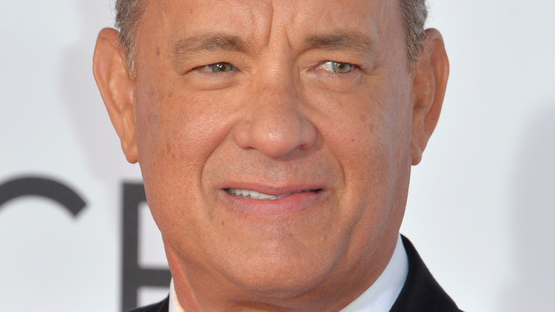 Tom Hanks awkwardly smiling