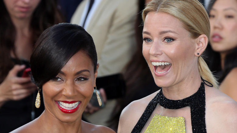 Jada Pinkett Smith smiling and Elizabeth Banks looking surprised