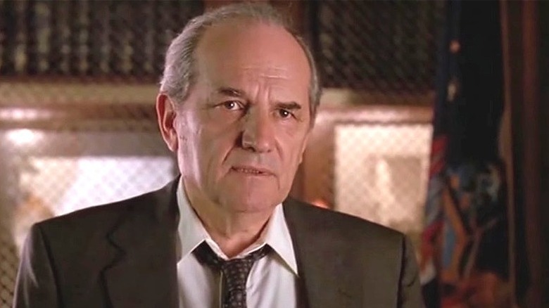 Steven Hill as DA Adam Schiff