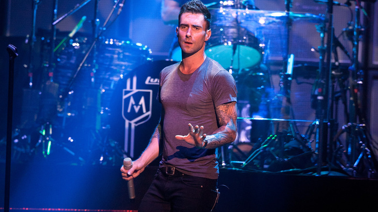 Adam Levine performing