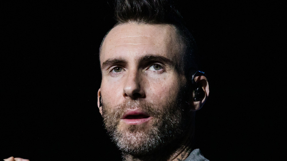 Adam Levine performing