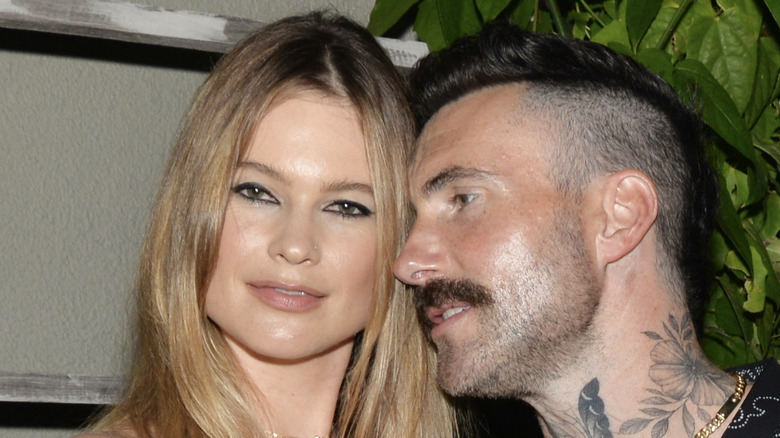 Adam Levine cuddling up to Behati Prinsloo